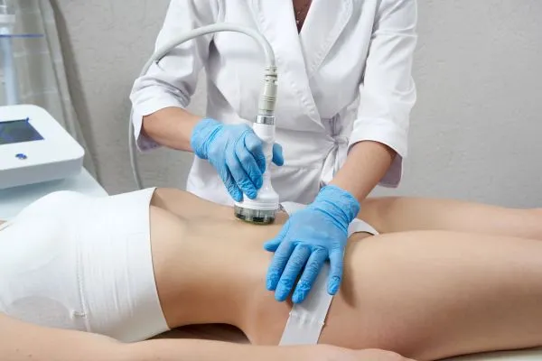 Lost the Weight but Not the Loose Skin? 2 woman having HIFU treatment on her stomach to combat loose skin Billingshurst following weight loss
